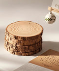 Stack of natural pine wood slices from Ready To Hang Wood Slices Craft Kit With 20 Natural Pine Discs And 8M Hemp Rope Pre-Drilled With 3mm Holes