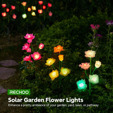 Solar Garden Lights Outdoor Decorative 3 Pack Rose Flower Pathway Lights with 7 Color Changing LEDs illuminating a garden path.