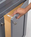 Adhesive Cabinet Latch Set For Child Safety, Peel And Stick Quick Install, No Tools Needed, shown on grey kitchen cabinet