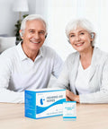 Front view of Hearing Aid Wipes box and a single sachet with alcohol-free towelettes on a table, blue packaging.