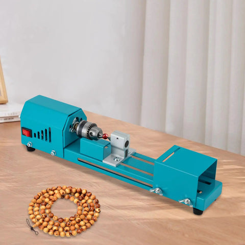 Mini Wood Lathe Machine With A Hella Strong 96W Copper Motor Spinning At 9000 Rpm on a table with wooden beads.
