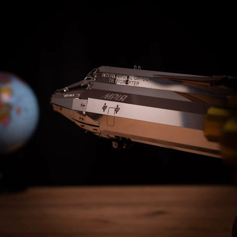 Close-up of Antonov Mriya AN-225 Exclusive Edition Mechanical Model Kit with globe in background, side view.