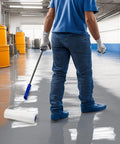 Person using 9 Inch Spiked Roller For Self Leveling Screeds And Epoxy Floors Pro Grade Bubble Removal Tool in a workshop.