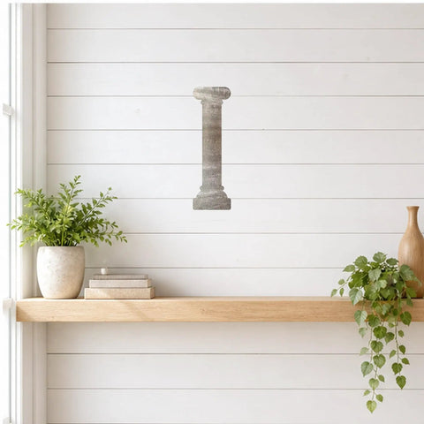 Raw 20 Gauge Mild Steel Column Cutout Wall Art for Craft and Garden Decor shown on white wall above shelf with plants.