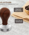 53mm Espresso Tamper With Walnut Handle and stainless steel base on textured surface