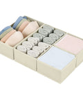 Fabric Drawer Organizers For Clothes, Dresser Bins With Adjustable Divider Panels, Closet Storage Cubes For Baby Knickknacks And Underwear, Beige Four Pack with rolled socks and linens.