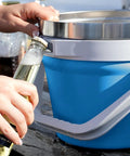 Person using bottle opener on Rock Solid 7 Liter Insulated Ice Bucket With Handy Bottle Opener Double Wall Vacuum Stainless Steel