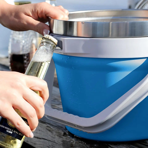 Person using bottle opener on Rock Solid 7 Liter Insulated Ice Bucket With Handy Bottle Opener Double Wall Vacuum Stainless Steel
