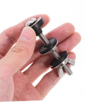 Close-up of stainless steel toilet seat screws and bolts set for quick replacement, rust resistant bathroom fasteners in hand