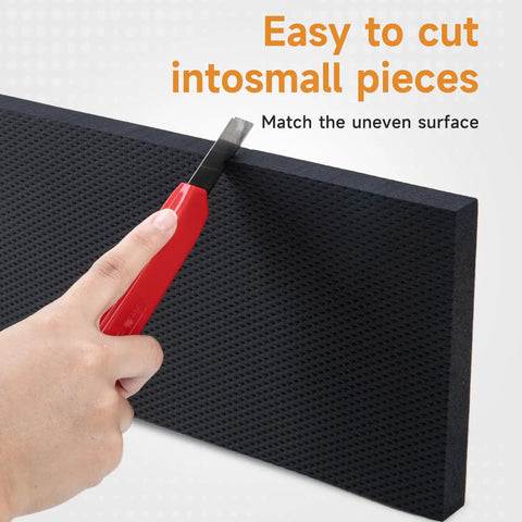 Cutting a black foam pad with a red utility knife; Garage Wall Protector For Cars And Home Heavy Duty Self Adhesive Foam Bumpers Guard Car Door Dings And Scratches 360 Degree Impact Protection Tough As Nails Tool Free Installation Durable Diamond Textured Pads