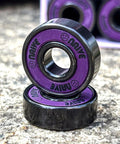 Neon purple 608 skate bearings with 8mm bore; multiple bearings shown