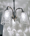 Chandelier with three-pack clear hammered glass lamp shade replacement 1-5/8 inch fitter, 6-1/16 inch tall globe cover