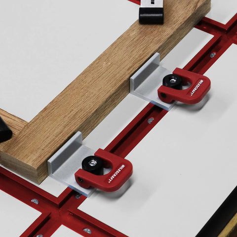 Inline Clamps T Track Clamp Two Pack With Cam Stops for woodworking on a table setup, low profile under 19mm with red components.