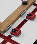 Heavy Duty 4 Pack T Track Cam Stops With Slam Tight Levers For Woodworking Jigs And T Slot Rails securing plywood on fixture table.