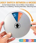 Person holding Six Status Six Inch Silver Office Door Sign With Magnetic Or Adhesive Backing Rotating Options Include WFH Working Remotely, Out Of Office, Do Not Disturb, Welcome Come In, Back Soon, In A Meeting For Clear And Quick Office Communication