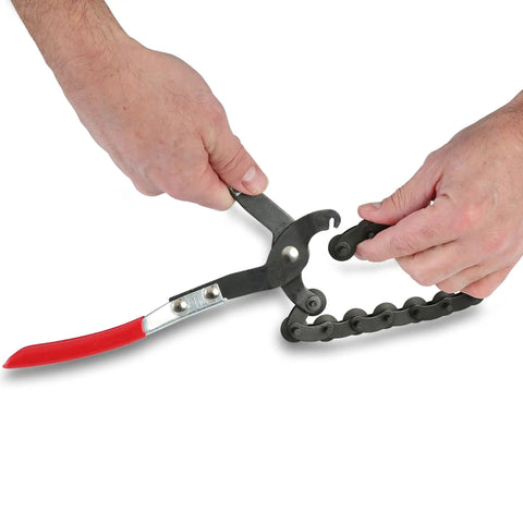 Exhaust Pipe Cutter Chain Tool For Three Quarter Inch To Three And A Quarter Inch Pipes with cushioned grip handles in use
