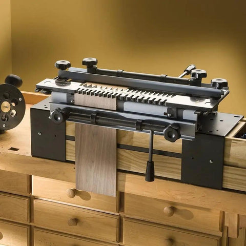 Slick Miniature Dovetail Template And Bit Kit on a workbench, perfect for creating accurate quarter inch finger joints on small projects.