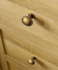 Top Shelf Antique Brass Cabinet Knobs Six Pack Round Single Hole Kitchen Furniture Hardware Easy DIY Install Vintage Inspired Close-up on drawer.