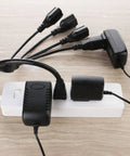 Three Prong To Four Way Power Cord Splitter 20 Inch Heavy Duty Extension Cord in use, connected to multiple devices on a power strip.