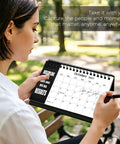 Coil Bound Small Desk Calendar 2026 2028 Black 24 Months July 2026 to June 2028 Inspirational Quotes Monthly Planner in use outdoors