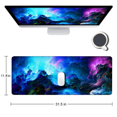 Ultra Wide Galaxy Desk Pad For Gaming And Work Non Slip Rubber Base Mouse Pad 31.5x11.8 Inch With Stitched Edges Keyboard And Mouse Mat Desk Pad Protector 3mm Thick Large Surface Smooth Glide shown on desk with monitor and coffee cup