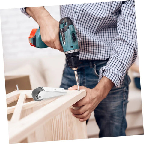 Person installing Heavy Duty Sliding Door Rollers Featuring Grooved Directional Wheels with a power drill on wooden furniture.