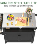 Weatherproof HIPS Outdoor Kitchen Island With Stainless Steel Top And Storage Cabinet Movable Prep Table With Wheels For BBQ And Outdoor Grilling Parties Black with fruits and meat on top