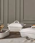 Premium Stoneware Covered Rectangular Casserole 4 Quart 12 By 9 Inch White Bakeware on dining table with food and decor