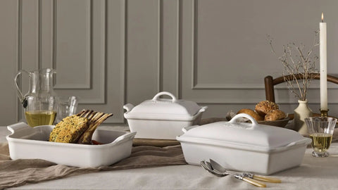Premium Stoneware Covered Rectangular Casserole 4 Quart 12 By 9 Inch White Bakeware on dining table with food and decor