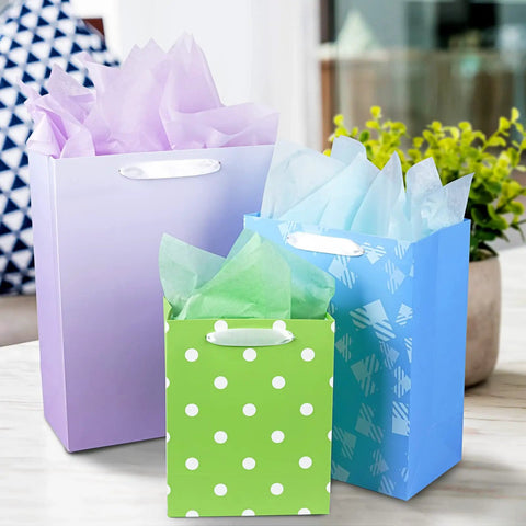 Party Ready 12 Pack Gift Bags Assorted Sizes With Tissue Paper Bulk Set For Birthdays Baby Showers Bridal Showers Easter And Any Occasion, featuring purple, blue, and green bags with tissue paper