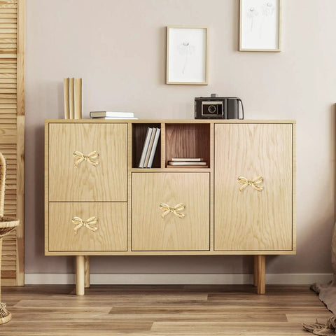 Bow Shape Cabinet Knobs Set Of 6 Brass Vintage Gold Finish Drawer Pulls For Dresser Kitchen Cupboard Wardrobe Decor Bow Hardware With Screws And Easy Install shown on a wooden cabinet in a living room setting.
