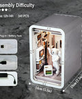 Space Capsule Book Nook Kit With LED Light, 3D wooden puzzle model showing interior details with astronaut figure.