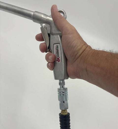 Industrial Style Air Quick Connect Plugs Nipples In Heat Treated Steel One Quarter Inch Male NPT attached to an air tool.