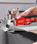 Sencan Cordless Electric Rotary Shear Cutter, 14.4V rechargeable fabric scissors cutting through thick black fabric.
