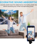 Couple jumping joyfully in front of decorative Heavy Duty Acoustic Wall Panels 72 By 48 Inch Sound Absorbing Room Divider Art Panel.