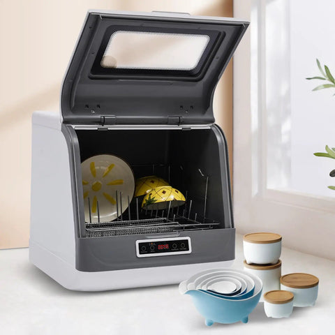 Compact Countertop Dishwasher With Four Wash Cycles Optimized For Small Kitchens delivering zero stress cleaning with plates inside.