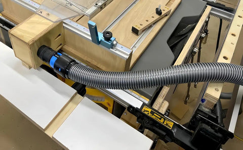 7 Piece Dust Collection Hose Adapters Kit For Home And Shop Vacuums connected to woodworking tool in workshop.