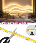 Bedroom with warm, glowing 3000K COB LED Strip Light, flexible and cuttable, highlighting modern wall decor above bed.
