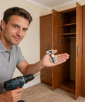 Man installing invisible cabinet hinges with soft close, stainless steel overlay hardware in a wood cabinet