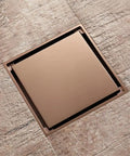 Rose Gold Bathroom Bathtub Drain Stopper With Anti Odor Plug For Shower Tile on textured floor tile, highlighting smooth finish.