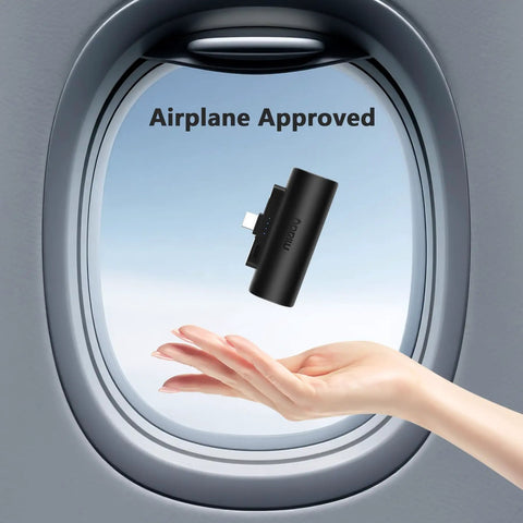 Grab And Go Mini Portable Charger Packing Sleek Built In Usb C Cable Plug Right Into Device No Tangled Cords To Deal With Pocket Sized Power Bank For Daily Grinds And Weekend Rides near airplane window with hand