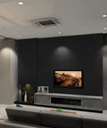 Modern living room with dark accent wall, TV, and decor items showcasing Peel And Stick Matte White Wallpaper For Walls And Furniture Self Adhesive White Contact Paper Removable Waterproof Easy DIY Kitchen Countertop Cabinet Wardrobe Makeover No Glue Required.