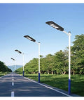 Badass 350W Solar Floodlight With Radar Human Body Induction Dusk To Dawn IP67 Waterproof LED Outdoor Security Light on a road.