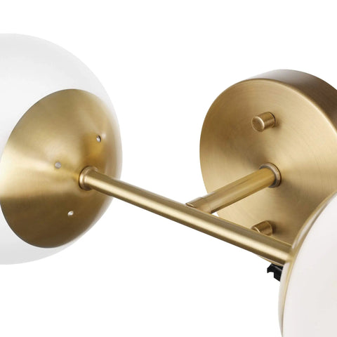 Close-up of Celestia 2-Light Wall Sconce In Matte Brass With Frosted Glass Shades For A Modern Glam Vibe And Soft Cozy Glow