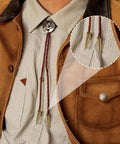 12 Piece Alloy Bolo Tie Cord End Caps Set in Three Colors, Vintage Cowboy Style Tips, 3 cm Long With 4 mm Inner Diameter for DIY Jewelry Making, Necklaces, Neckties, and Craft End Caps. Brass bolo tie tips on burgundy cord on a shirt
