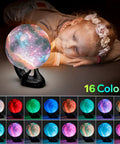 Child admiring 7.1 Inch Galaxy Moon Lamp 3D Printed Moon With NASA Imagery, 16 Color Changes, Remote Or Touch Control, USB Rechargeable, Black Hand Base