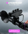 120dB Waterproof Bike Horn With 300mAh Rechargeable Battery installed on handlebar in rain, showing button control.