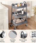 Three Tier Metal Rolling Cart With Lockable Wheels, Heavy Duty Mobile Storage Shelf For Living Room, Kitchen, Office Or Bathroom, Rust Resistant Steel, Adjustable Shelves, Grey, placed near a cabinet.