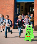 Three Pack Kids Playing Signs For Street Reflective Slow Down Alert Sign With Double Sided Text Graphics installed near school entrance.