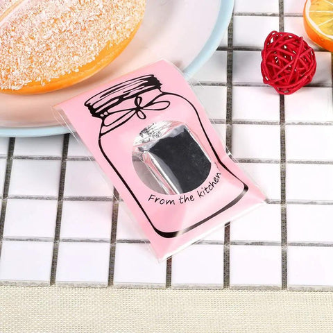 100 Pcs Lovely Plastic Cookies Gift Packaging Bags For Party Supplies Pink Food Grade Safe And Durable Ideal For Weddings Birthdays And Celebrations Everywhere, showing pink bag with clear window.